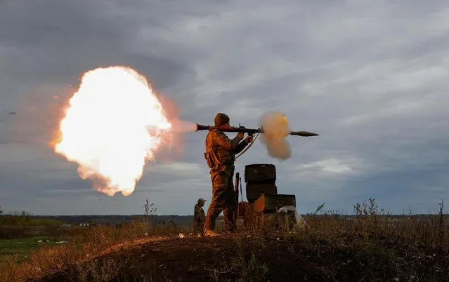 A newly-mobilised Russian reservist fires a rocket-propelled grenade (RPG) launcher during a training on a range in Donetsk region, Russian-controlled Ukraine on October 4, 2022. (Photo by Alexander Ermochenko/Reuters)