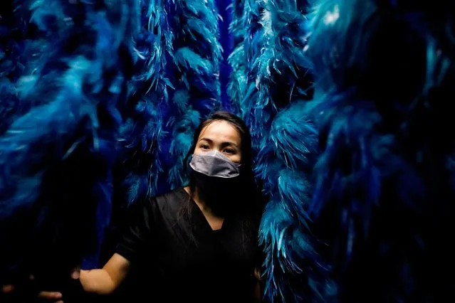 A visitor visits Vivo art exhibition at Lotte Shopping Avenue mall in Jakarta, Indonesia on October 5, 2022. (Photo by Ajeng Dinar Ulfiana/Reuters)