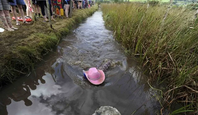 A competitor takes part in the 31st World Bog Snorkelling Championships, held annually at Llanwrtyd Wells in Wales, Britain August 28, 2016. (Photo by Rebecca Naden/Reuters)