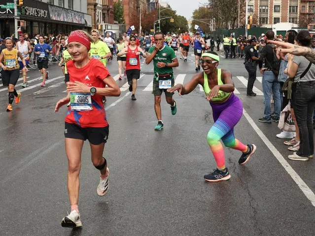 Runners in action in Harlem during the 2022 TCS New York City Marathon on November 06, 2022 in New York City. (Photo by Caitlin Ochs/Reuters)