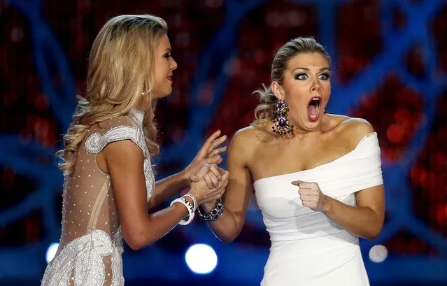 Miss New York, Mallory Hagan, right, reacts with Miss South Carolina Ali Rogers as she is named Miss America 2013, on January 12, 2013. (Photo by Isaac Brekken/Associated Press)
