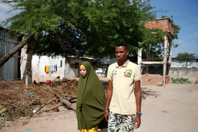 Somali couple Mohamed Noor and Huda Omar go for a walk in Mogadishu's Rajo camp, Somalia August 26, 2016. (Photo by Feisal Omar/Reuters)