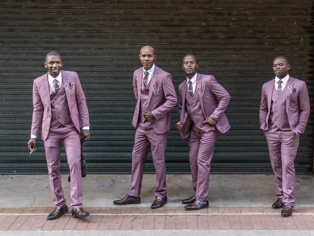Members of a traditional Isicathamiya group pose for a photo outside the Natal Playhouse Theatre during an Isicathamiya concert in Durban on May 24, 2025. The concert includes several groups showcasing the Isicathamiya style, an a capella choral singing style developed in South Africa by migrant Zulu communities. (Photo by Rajesh Jantilal/AFP Photo)