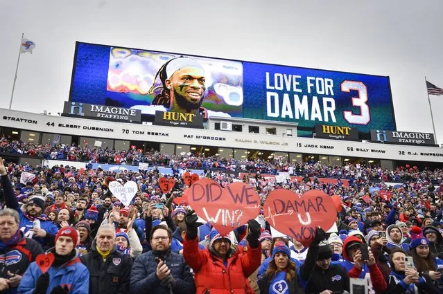 Fans stand in support for Buffalo Bills safety Damar Hamlin (3) before an NFL football game against the New England Patriots, Sunday, January 8, 2023, in Orchard Park, N.Y. Hamlin remains hospitalized after suffering a catastrophic on-field collapse in the team's previous game against the Cincinnati Bengals. (Photo by Adrian Kraus/AP Photo)