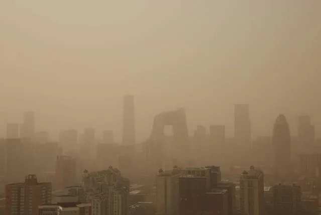 A general view of the skyscrapers in the sandstorm on February 28, 2013 in Beijing, China. Beijing was hit by its first sandstorm of the year while its air quality reached dangerous level on Thursday.  (Photo by Feng Li)