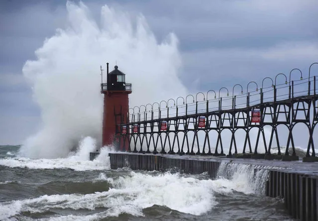 Lake Michigan waves crash into the South Haven Lighthouse Wednesday, November 30, 2022, in South Haven, Mich. (Photo by Don Campbell/The Herald-Palladium via AP Photo)