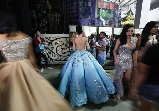 Contestants prepare backstage during the annual transgender beauty contest of Miss International Queen 2018 at Pattaya city, in Chonburi province, Thailand, 09 March 2018. (Photo by Narong Sangnak/EPA/EFE)
