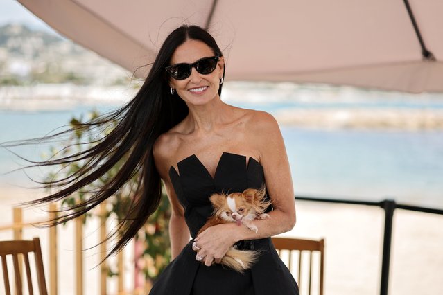 American actress Demi Moore and her dog Pilaf attend a talk at the 77th annual Cannes Film Festival at American Pavillion on May 19, 2024 in Cannes, France. (Photo by Neilson Barnard/Getty Images)