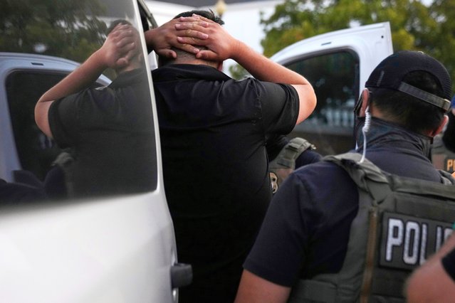 U.S. Immigration and Customs Enforcement agents make an arrest during an early morning operation in Park Ridge, Ill., Friday, September 19, 2025. (Photo by Erin Hooley/AP Photo)
