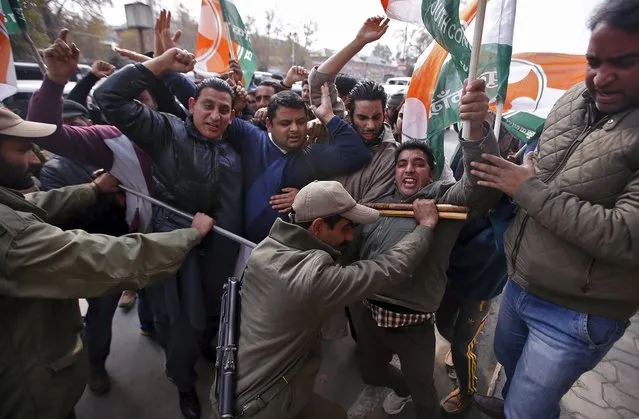 Workers of the youth wing of India's opposition Congress party shout slogans as they scuffle with police during a protest in Srinagar, November 3, 2015. Indian police detained dozens of workers on Tuesday during the demonstration against what protesters said were rising communal tension and a lack of jobs in Jammu and Kashmir state, a party spokesman said. (Photo by Danish Ismail/Reuters)