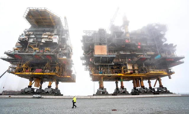 The Tyra East and Tyra West oil and gas processing platforms due to be scrapped are pictured as the work of scrapping and recycling of The Tyra field platforms is underway at the port of Frederikshavn in Denmark, on September 15, 2020. For 35 years, the Tyra Field in the North Sea has been Denmark's largest supplier of natural gas, and now its platforms Tyra Est and Tyra West will be scrapped and recycled by MARS (Modern American Recycling Services) at Frederikshavn Harbor. (Photo by Henning Bagger/Ritzau Scanpix/AFP Photo)