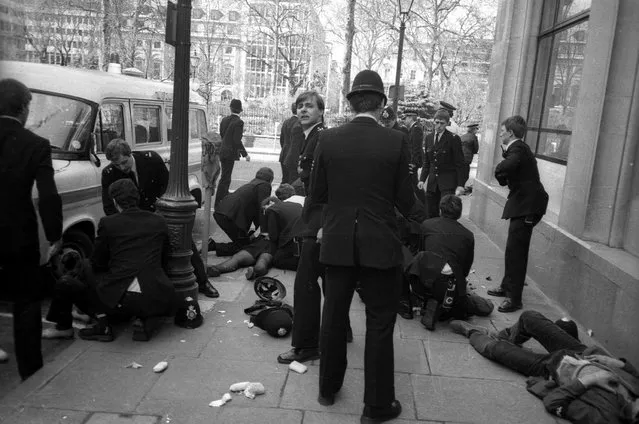 Police officers surround police constable Yvonne Fletcher after she was shot during a protest against Libyan leader Colonel Muammar Gaddafi in London, in this file photograph dated April 17, 1984. British police said they had arrested a Libyan man on November 19, 2015 for the 1984 murder of Fletcher who was shot dead outside the Libyan embassy in London. (Photo by Clive Challis/Reuters)