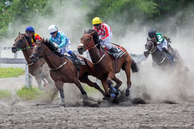 Jockeys compete during the Piala Raja Hamengku Buwono X 2025, an annual national horse racing championship for the royal trophy of Sultan Hamengku Buwono X of the Yogyakarta Palace, at the Sultan Agung racetrack in Bantul, Yogyakarta, on November 9, 2025. (Photo by Devi Rahman/AFP Photo)
