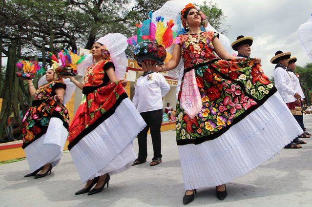 Traditional Oaxacan dancers perform during the Guelaguetza 2024 festival in Villa de Zaachila, Oaxaca state, Mexico on July 29, 2024. Every year, the Guelaguetza festival showcases a big sample of Mexican folklore, including food, music and traditional dance. (Photo by Patricia Castellanos/AFP Photo)