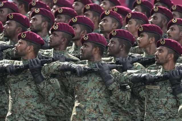 Sri Lanka army commando regiment soldiers march during the 75th Independence Day ceremony in Colombo, Sri Lanka, Saturday, February 4, 2023. (Photo by Eranga Jayawardena/AP Photo)
