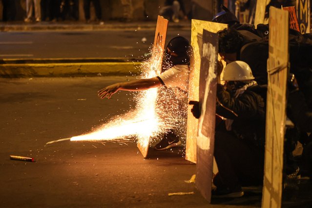 Demonstrators clash with anti-riot police officers during protests against Peru's interim President Jose Jeri in Lima on October 15, 2025.  (Photo by Hugo Curotto/AFP Photo)