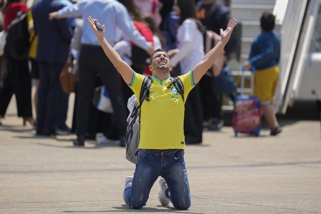 A Brazilian reacts after the Air Force evacuated him from Lebanon amid Israeli airstrikes, at the Air Force base in Guarulhos, greater Sao Paulo area, Brazil, Sunday, October 6, 2024. (Photo by Andre Penner/AP Photo)