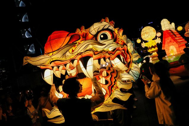 Buddhist believers carry a giant dragon-shaped lantern during a Lotus Lantern parade in celebration of the upcoming birthday of Buddha in Seoul, South Korea on May 20, 2023. (Photo by Kim Soo-hyeon/Reuters)