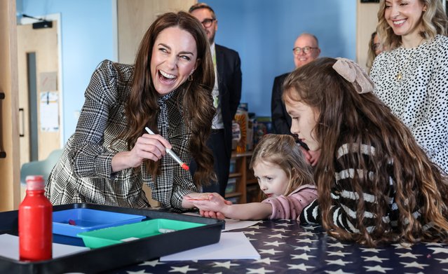 The Princess of Wales on January 30, 2025 painted the hand of Maggie, four, so that she could feature on the wall of handprints at Tŷ Hafan, a children’s hospice based in Sully, near Cardiff, where her sibling is being treated. (Photo by Richard Pohle/The Times)