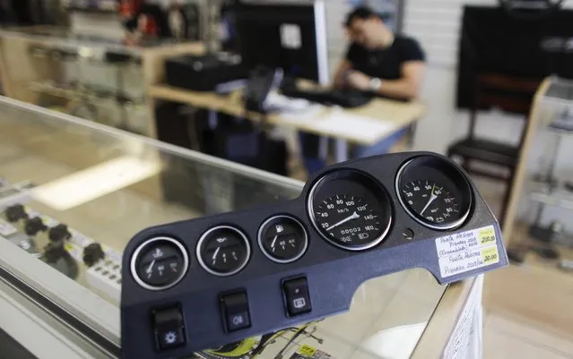 A part for the dashboard for Lada cars sits on a counter in Fabian Zakharov's Zakharov Auto Parts in Hialeah, Florida, February 4, 2015. (Photo by Javier Galeano/Reuters)