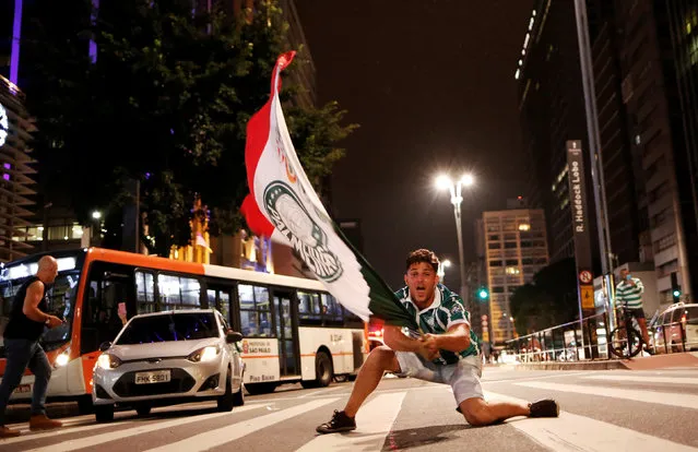 Palmeiras' fan celebrates their ninth Brazilian league title at Paulista Avenue in Sao Paulo, Brazil, November 27, 2016. (Photo by Nacho Doce/Reuters)