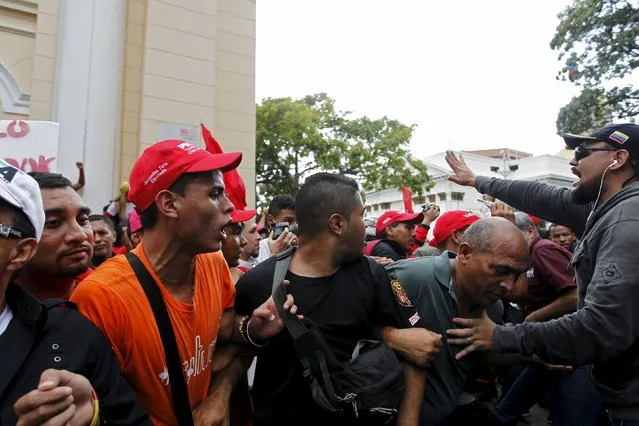 Supporters of Venezuela's President Nicolas Maduro try to organise before the exit of the official deputies from the building housing the National Assembly in Caracas, January 5, 2016. (Photo by Christian Veron/Reuters)