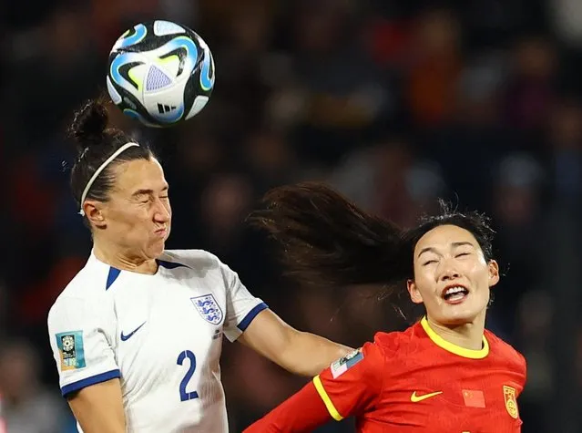 Lucy Bronze of England and Yang Lina of China PR during the FIFA Women's World Cup Australia & New Zealand 2023 Group D match between China and England at Hindmarsh Stadium on August 01, 2023 in Adelaide, Australia. (Photo by Hannah Mckay/Reuters)