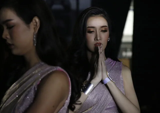 A contestant for Miss Tiffany's Universe Thailand 2018 prays as she gets ready backstage during the annual transgender beauty contest “Miss Tiffany's Universe Thailand 2018” at the Tiffany's Show Theatre in Pattaya city, Chonburi province, Thailand, 31 August 2018. (Photo by Narong Sangnak/EPA/EFE)