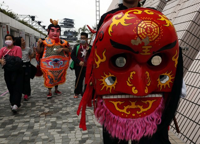 Students from Taiwan Shih Chien University Sung Jiang Battle Array walk during a rehearsal ahead of a Lunar New Year night parade in Hong Kong, February 18, 2015. (Photo by Bobby Yip/Reuters)