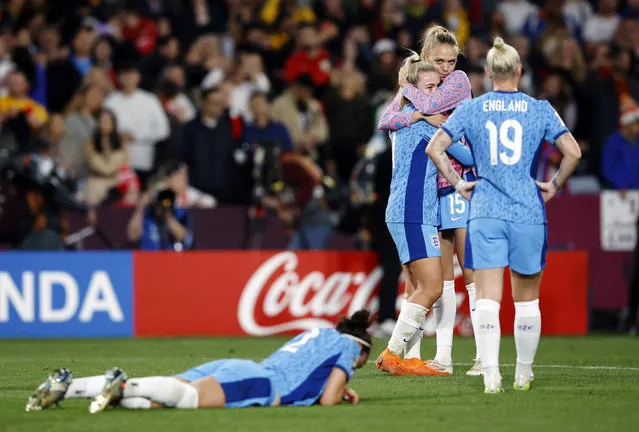 Lauren Hemp and Esme Morgan of England show dejection after the team’s defeat following the FIFA Women's World Cup Australia & New Zealand 2023 Final match between Spain and England at Stadium Australia on August 20, 2023 in Sydney / Gadigal, Australia. (Photo by Amanda Perobelli/Reuters)