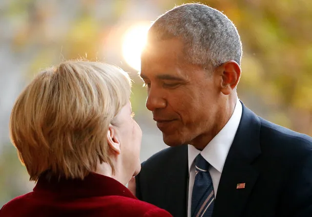 President Barack Obama is welcomed by German Chancellor Angela Merkel upon his arrival at the chancellery in Berlin, Germany, November 17, 2016. (Photo by Fabrizio Bensch/Reuters)