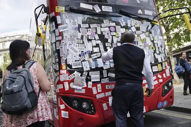 A London Bus is covered in anti-vaccine stickers near Trafalgar Square after an anti-vaccine protest mass demonstration in central London, Saturday May 29, 2021. The bus was set upon by passing anti-vaccine protesters demanding various social freedoms. (Photo by Aaron Chown/PA Wire via AP Photo)