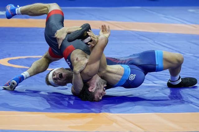 Zaurbek Sidakov of Russia, left, and Kyle Douglas Dake of the US compete in their men's freestyle 74 kg wrestling final match during the Wrestling World Championships in Belgrade, Serbia, Monday, September 18, 2023. (Photo by Darko Vojinovic/AP Photo)