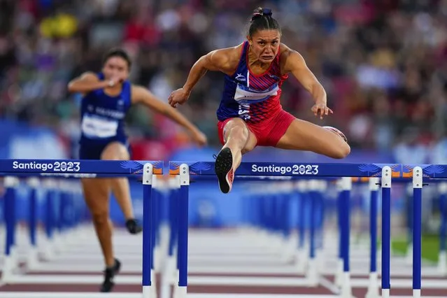 Costa Rica's Andrea Vargas competes in a women's 100-meter hurdles semifinal at the Pan American Games in Santiago, Chile, Tuesday, October 31, 2023. (Photo by Natacha Pisarenko/AP Photo)