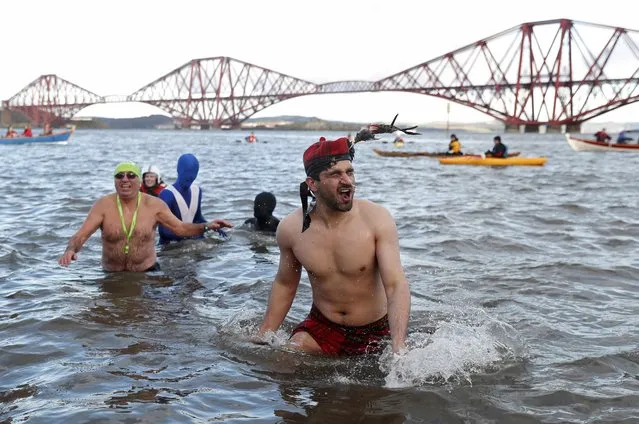 Swimmers in fancy dress participate in the New Year's Day Loony Dook swim at South Queensferry in Scotland, Britain, January 1, 2017. (Photo by Russell Cheyne/Reuters)