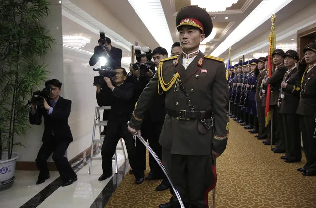 North Korean media take video footage and photos as Choe Ryong Hae, (unseen in photo) vice chairman of North Korea's State Affairs Commission, makes his way to the departure gates at the Pyongyang Airport after inspecting honor guards on Friday, January 6, 2017, in Pyongyang, North Korea. Hae is heading to Nicaragua to attend the inauguration of their newly elected President Daniel Ortega. (Photo by Wong Maye-E/AP Photo)
