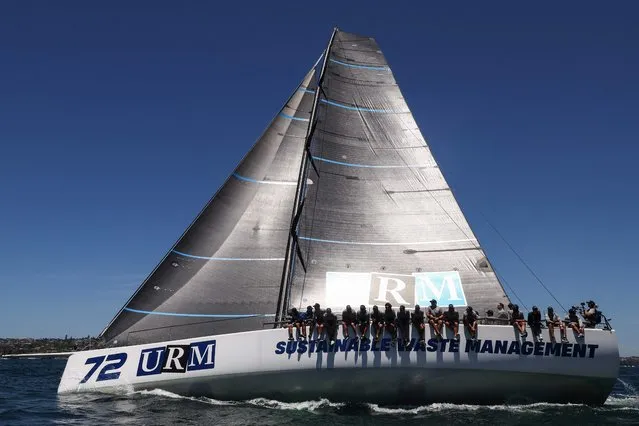 The Anthony Johnston skippered URM Group competes during the SOLAS Big Boat Challenge race in the harbour in Sydney on December 5, 2023. (Photo by Saeed Khan/AFP Photo)