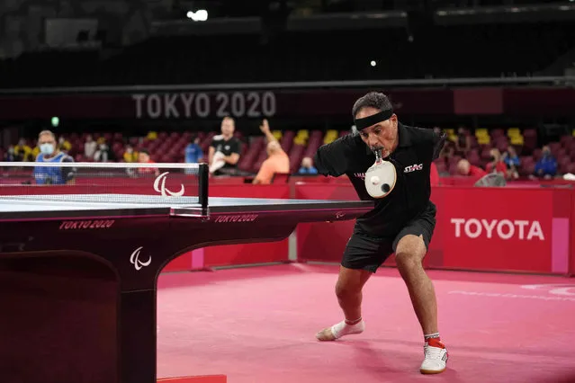 Ibrahim Hamadtou of Egypt plays against Park Hong-kyu of South Korea in Class 6, Group E of men's table tennis at the Tokyo 2020 Paralympic Games Wednesday, August 25, 2021, in Tokyo, Japan. (Photo by Eugene Hoshiko/AP Photo)