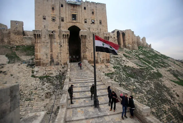 People visit Aleppo's historic citadel, in the Old City of Aleppo, Syria January 31, 2017. (Photo by Ali Hashisho/Reuters)