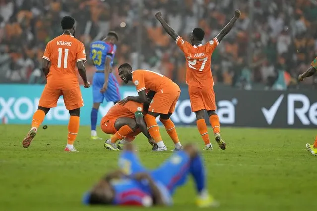 Ivory Coast players, top center, celebrate after winning the African Cup of Nations semifinal soccer match between Ivory Coast and DR Congo, at the Olympic Stadium of Ebimpe in Abidjan, Ivory Coast, Wednesday, February 7, 2024. Ivory Coast won the match 1-0. (Photo by Sunday Alamba/AP Photo)