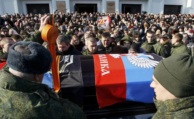 People attend a memorial service before the funeral of Mikhail Tolstykh, commander of the separatist self-proclaimed Donetsk People's Republic known by the nom de guerre “Givi”, in Donetsk, Ukraine, February 10, 2017. (Photo by Alexander Ermochenko/Reuters)