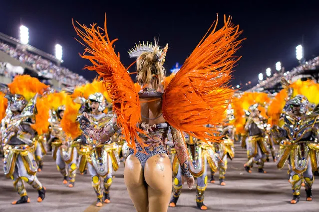 Members of Unidos da Tijuca Samba School during their parade at 2014 Brazilian Carnival at Sapucai Sambadrome on March 03, 2014 in Rio de Janeiro, Brazil. Rio's two nights of Carnival parades began on March 2 in a burst of fireworks and to the cheers of thousands of tourists and locals who have previously enjoyed street celebrations (known as “blocos de rua”) all around the city. (Photo by Buda Mendes/Getty Images)