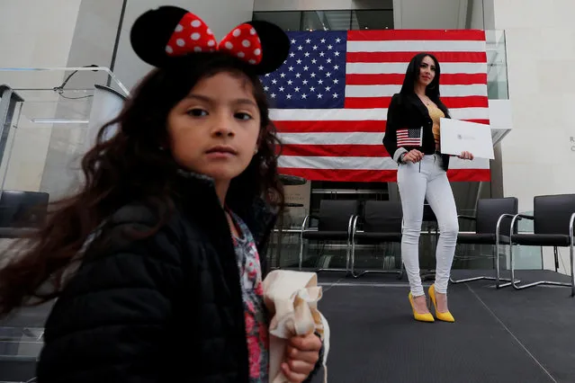 Maria Tejada, originally from El Salvador, poses for a photo after becoming a U.S. citizen, with her five year-old daughter Ashley (L) in attendance, during an official Naturalization Ceremony at the Museum of Fine Arts, Boston in Boston, Massachusetts, U.S., May 6, 2019. (Photo by Brian Snyder/Reuters)