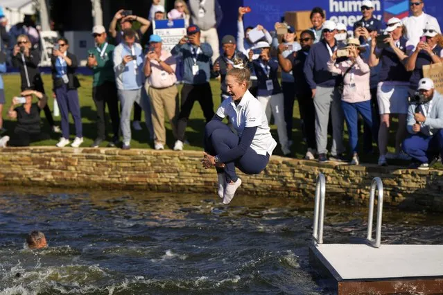 Nelly Korda jumps into the lake after winning the Chevron Championship LPGA golf tournament Sunday, April 21, 2024, at The Club at Carlton Woods in The Woodlands, Texas. (Photo by David J. Phillip/AP Photo)