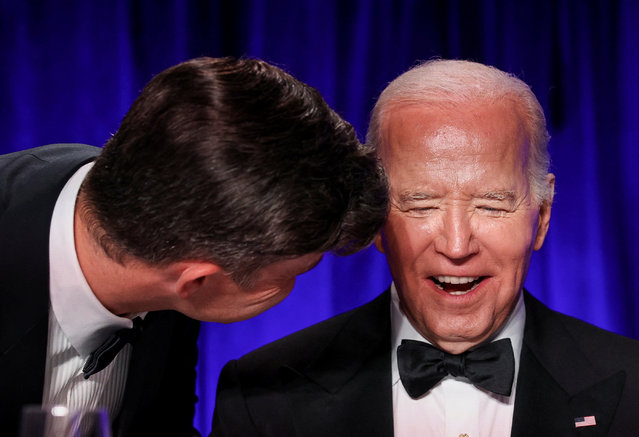 U.S. President Joe Biden reacts as host Colin Jost speaks to him during the White House Correspondents' Association Dinner in Washington, U.S., April 27, 2024. (Photo by Tom Brenner/Reuters)