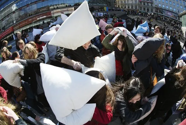 Young people take part in the International Pillow Fight Day on April 5, 2014 in Stockholm, Sweden. Pillow fights take place in various places around the world on April 5, 2014. (Photo by Jonathan Nackstrand/AFP Photo)