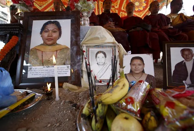 Offerings are seen in front of portraits of earthquake victims during the first anniversary of the earthquake in Kathmandu, Nepal, April 24, 2016. (Photo by Navesh Chitrakar/Reuters)