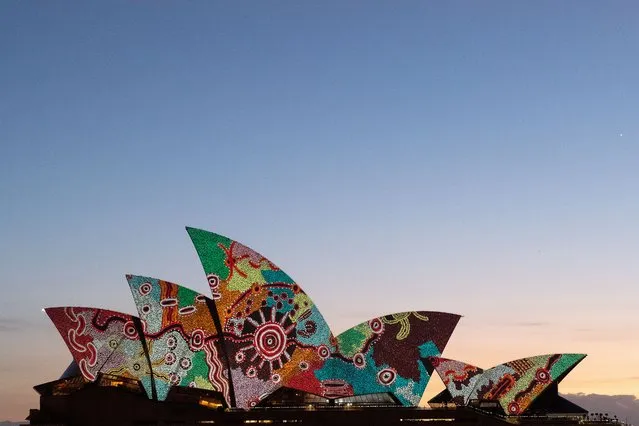 Artwork by Pitjantjatjara man Yadjidta David Miller is projected onto the sails of the Sydney Opera House at dawn during Australia Day 2022 celebrations in Sydney, Australia, 26 January 2022. (Photo by Bianca De Marchi/EPA/EFE)