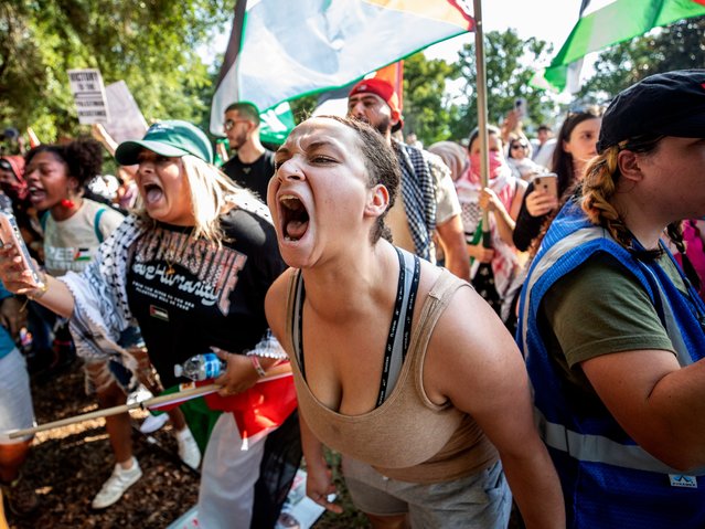 Pro-Palestian protesters yell at Orlando Police Department officers after they took two protesters into custody and deployed a noxious gas into the crowd during a rally in Orlando, Fla., Saturday, May 11, 2024. (Photo by Willie J. Allen Jr./Orlando Sentinel via AP Photo)