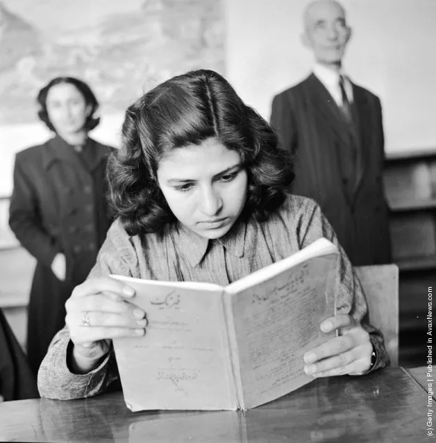 1952:  A girl student at a vocational training school for seamstresses studies the theoretical aspects of her work. This is one of the first schools for girls founded by the government in Teheran